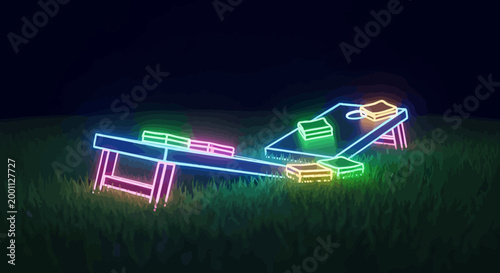 Neon Glow Cornhole Boards on Grass at Night.