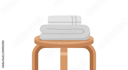 Stack of white towels on stool.