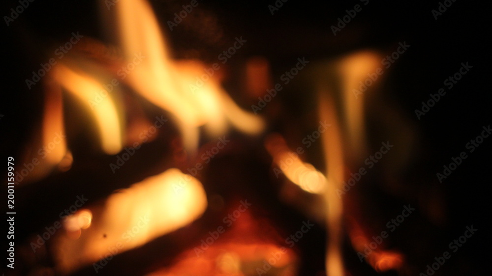 Fototapeta premium Fire flames, wood logs burning in fireplace