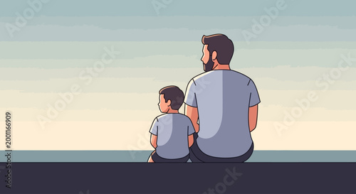 father and son sitting on beach watching sunset