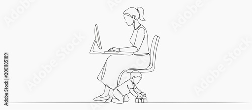 A mother working at a computer while her child plays nearby. This illustrates the challenges of balancing work and family life. 