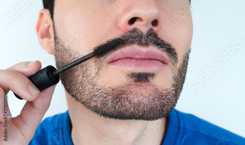 Fényképezés Close up of man applying temporary mustache color to fill in thin patchy areas a