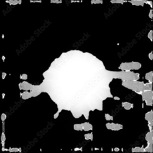 A large white splatter is visible on a black background with gray splotches.