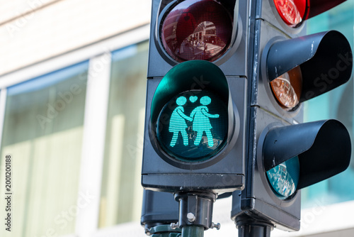 Canvas Print Adorable traffic light in Stockholm Sweden with two people holding hands and a h