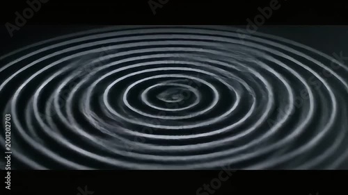 Ripple effect, concentric circles, water ripple, wave pattern, dark background
