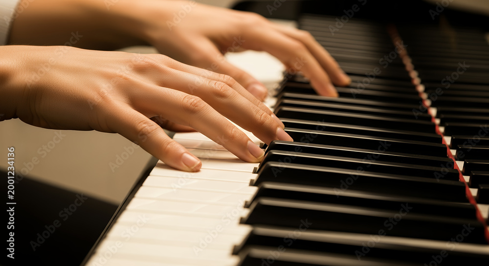 Fototapeta premium Person Play Piano Keyboard, Music Practice and Creative Expression Concept