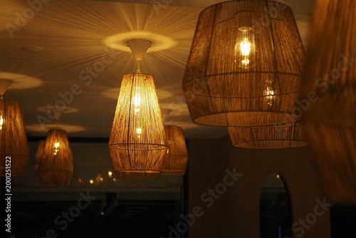 Bild auf Leinwand Light fixtures create warm glow in indoor space