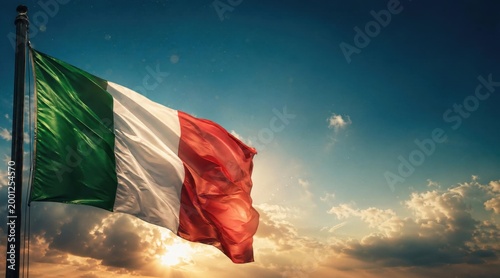 Italian flag waving in front of a blue sky at sunset