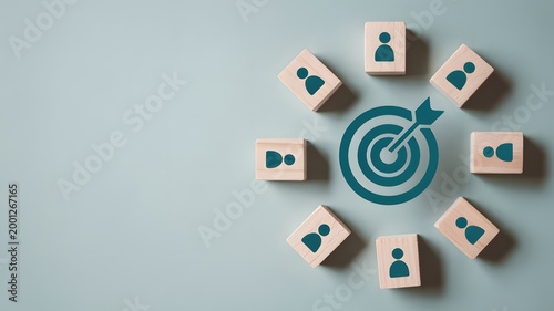 Targeted audience concept with wooden blocks and a bullseye target icon