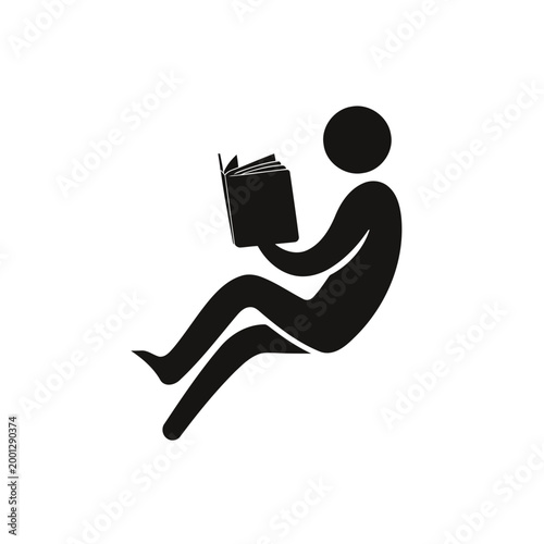 Person sitting and reading a book in a relaxed posture.