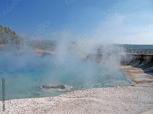 Excelsior Geyser pool with Steam rises from turquoise hot spring water  in Yellowstone National park