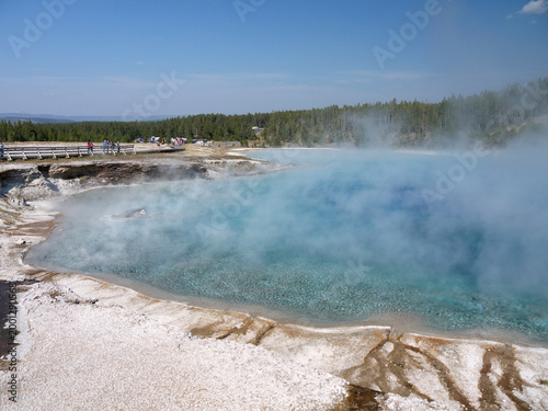Excelsior Geyser pool with Steam rises from turquoise hot spring water  in Yellowstone National park