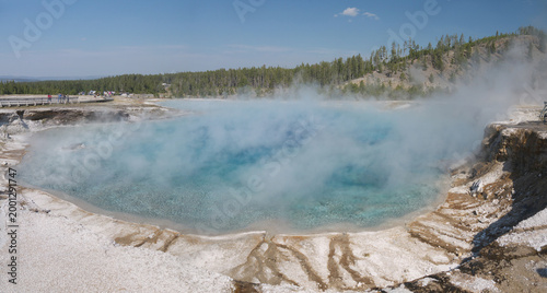 Excelsior Geyser pool panoramic view with Steam rises from turquoise hot spring water in Yellowstone National park
