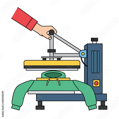A hand operates a heat press machine on a green hoodie indoors.