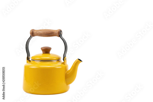 Obraz na plátně Bright yellow whistling tea kettle with wooden handle