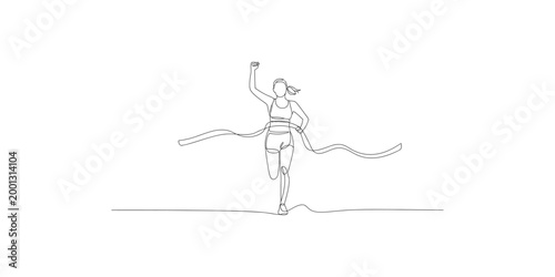 A woman in athletic wear running with her arm raised in victory