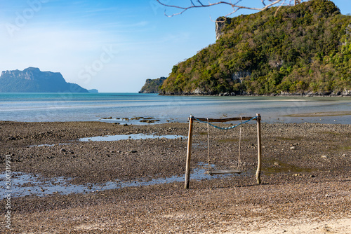 Empty Wooden Swing on Rocky Shore at Low Tide, Koh Phaluai, Thailand