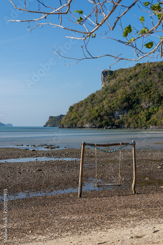 Empty Wooden Swing on Rocky Shore at Low Tide, Koh Phaluai, Thailand
