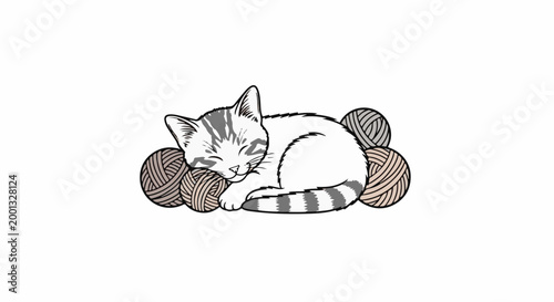 A content kitten with grey stripes sleeps nestled amongst balls of yarn