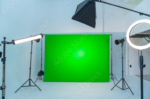 Empty production studio with green screen and lighting equipment