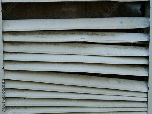 Photography broken ventilation slats caused by trucks maneuvering