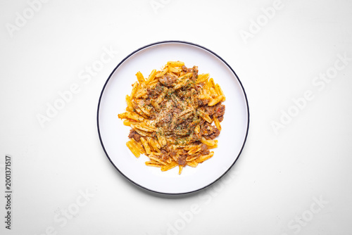 Top view of pasta with minced beef sauce on white plate over white background, rich Italian comfort food, savory texture, rustic style, homemade meal, warm tones, restaurant cuisine gourmet dining
