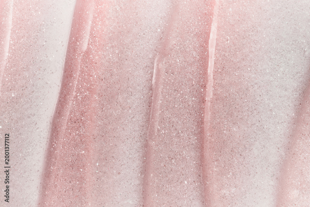 Fototapeta premium Shimmering pink cosmetic cream texture creating beautiful abstract background