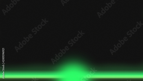 Vibrant green laser light creates an intense glowing illumination on a mysterious dark background.