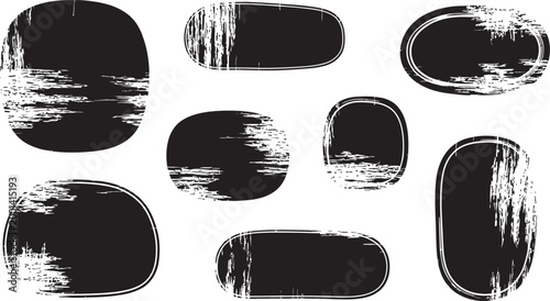 Abstract brush strokes collection a variety of black paint smudges and textural shapes on a white background