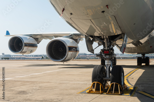 Wide-body commercial aircraft with four engines and landing gear