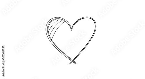 A heart shaped metal object sits on a clean surface.