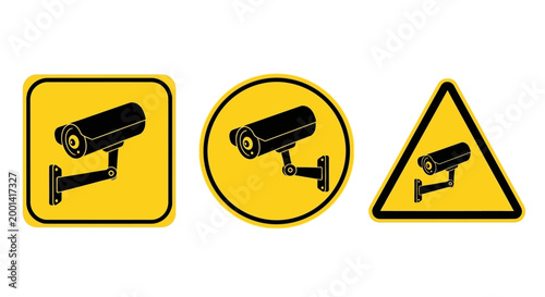 Three security camera icons on yellow warning signs are displayed.