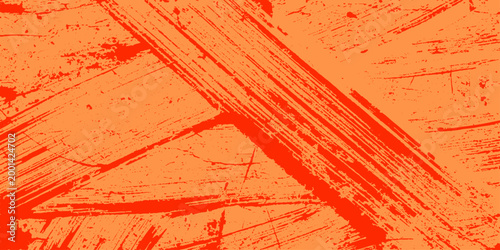 Vibrant orange background with dynamic red brush strokes and scratches for creative design projects and artistic expression