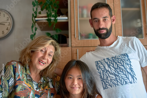 Three generations celebrating a joyful birthday together, smiling and creating unforgettable memories