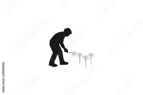 Man planting small trees in a row silhouette