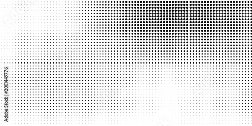 A close-up view of a gray gradient background with small squares