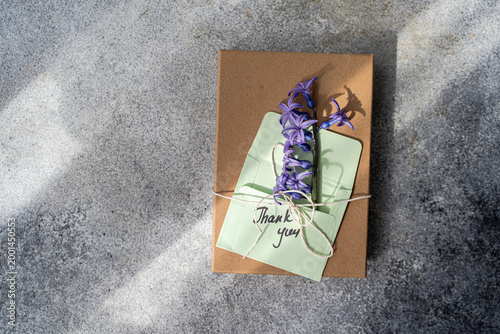 Gift box with thank you card and purple hyacinth