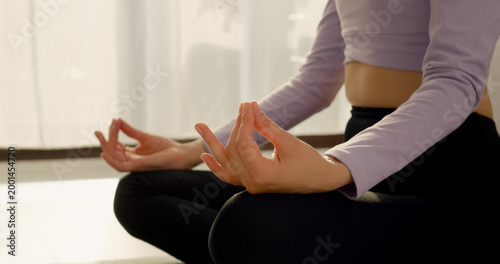Bild auf Leinwand Close up of a woman hands who engages in yoga and meditation to cultivate mental balance and promote a healthy lifestyle on a peaceful morning
