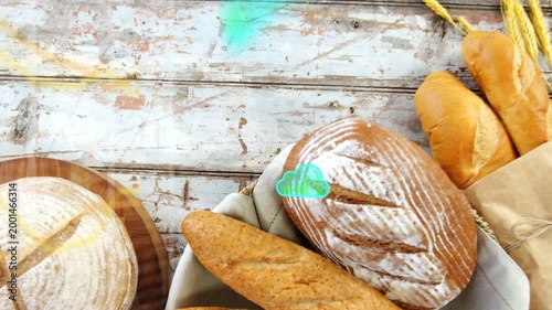 On teal blobs appearing, overlays sweeping across artisanal bread, view rising to highlight rolls
