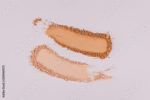 A chic example of the texture of a compact powder in a different tones. texture of decorative cosmetics. A sample to advertise your product. Top view.