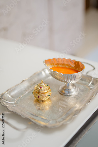 haldi and sindoor in a silver tray