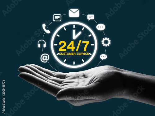 A hand supporting a glowing 24/7 customer service clock with icons