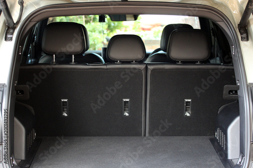 Modern car interior viewed from the open rear hatch