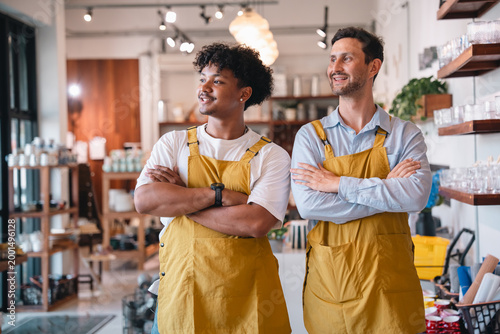 Photos Men apron smiling crossed arm shop interior team work small business retail