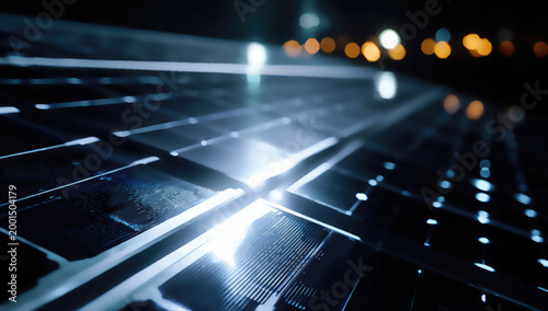Close-up, futuristic view of solar panels at night, illuminated