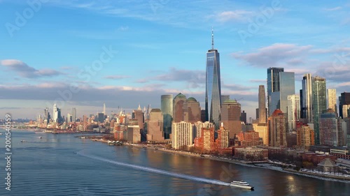 One World Trade Center in urban skyline of American city. Freedom Tower in business district skyline of Lower Manhattan. World Trade Center skyline of financial district. Manhattan skyline.