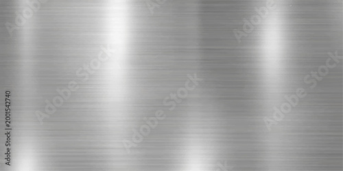 A minimalist close-up shot of a textured metallic surface with subtle directional light.