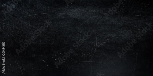 Dark and textured surface, an abstract image of a grainy, distressed surface, hinting at a sense of age and a storied past.