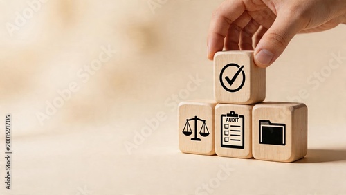 Business man stacking wooden cubes with audit folder and check mark icons symbolizing corporate compliance legal affairs risk management quality control financial statement review