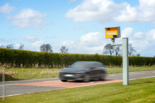 Valokuva Radar speed camera and fast speeding car on the road
